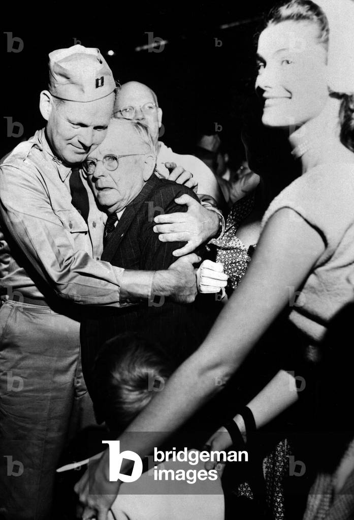Repatriated POW Capt. Frederick Smith is greeted by his father on Sept. 14, 1953. Sept. 14, 1953. Fort Mason, California. Korean War, 1950-53
