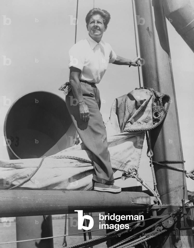 Joe Carstairs on the rigging of her yacht Sonia 2 in 1944. Marion Barbara 'Joe' Carstairs was openly lesbian, wore men's clothes, tattooed her arms, and raced boats.