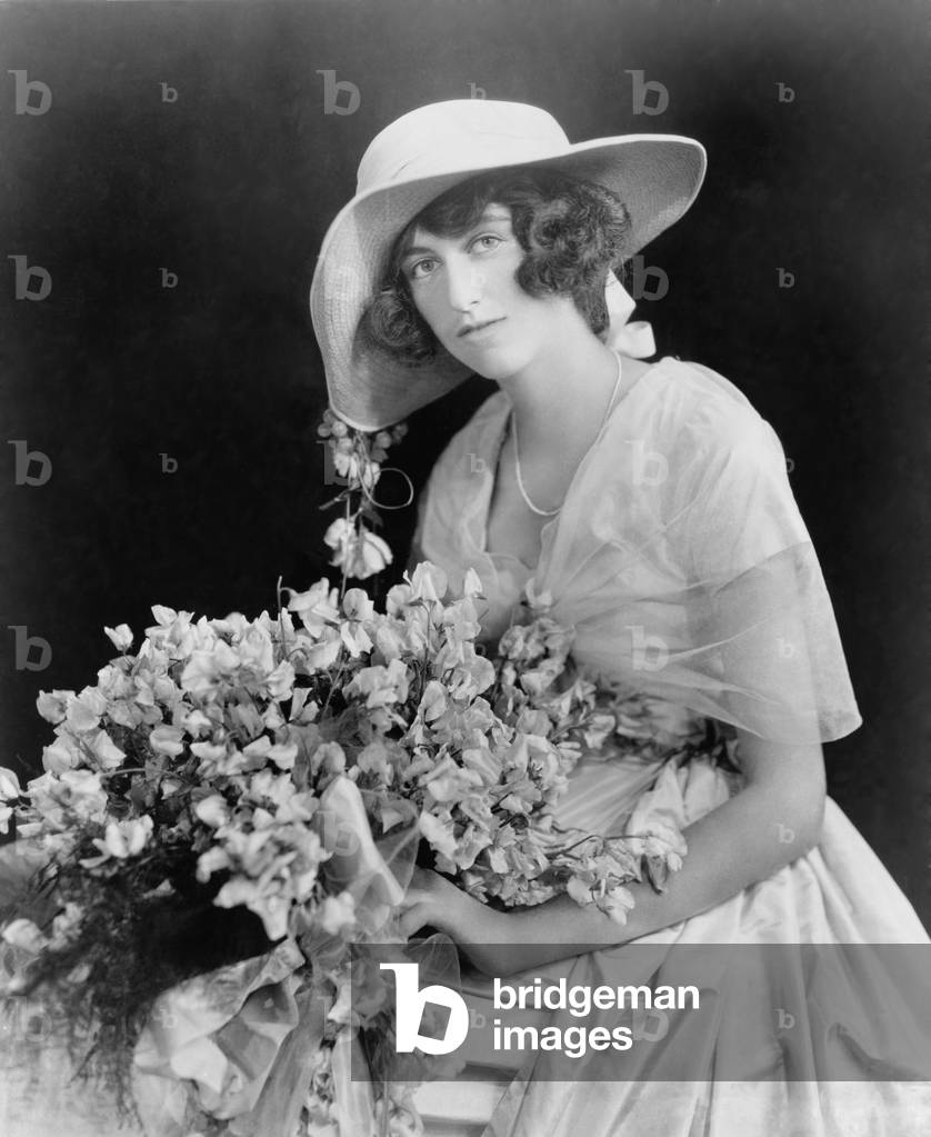 Cornelia Stuyvesant Vanderbilt (1900-1976), only child of George W. Vanderbilt and Edith Stuyvesant Dresser holding a bouquet of flowers on the announcement of her engagement to British diplomat, John Francis Amherst Cecil. The couple had two sons before their 1934 divorce