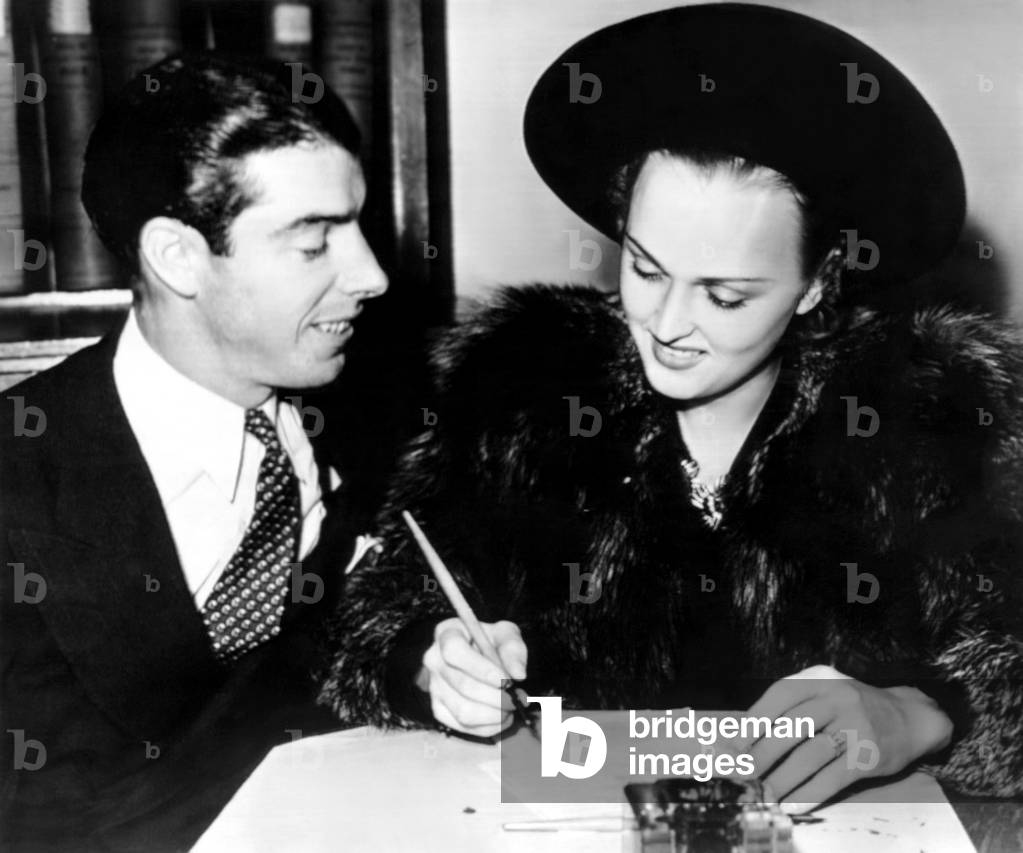 Joe DiMaggio and Dorothy Arnold as they file their intent to wed application. November 10, 1939
