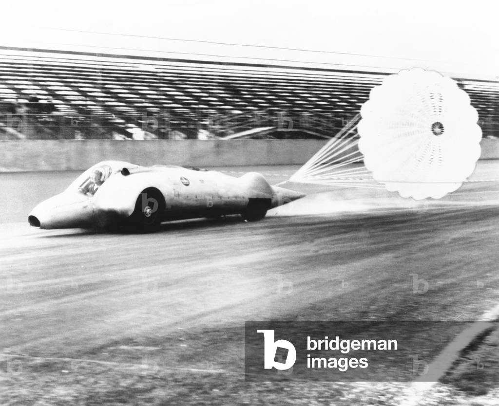 Art Arfons on the Thompson Raceway dragstrip opens twin parachutes to decelerate speed. 1962