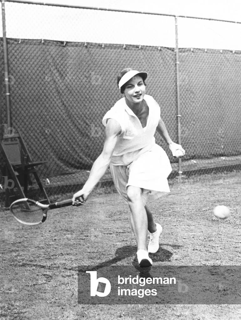 Helen Wills Moody in Doubles action at the U.S. Tennis Championships, Forest Hills. Aug. 1931. She won the U.S. Women's Singles Tennis Championship