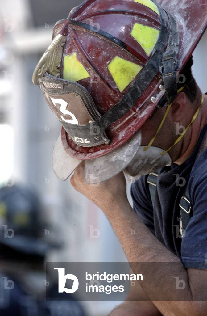 NYC Fireman takes a break during the rescue operations on Sept. 14, 2001. Only 13 people were from rescued alive from under the debris, and those were found within the first 24 hours. New York City, after September 11, 2001 terrorist attacks. U.S. Navy Photo by Jim Watson