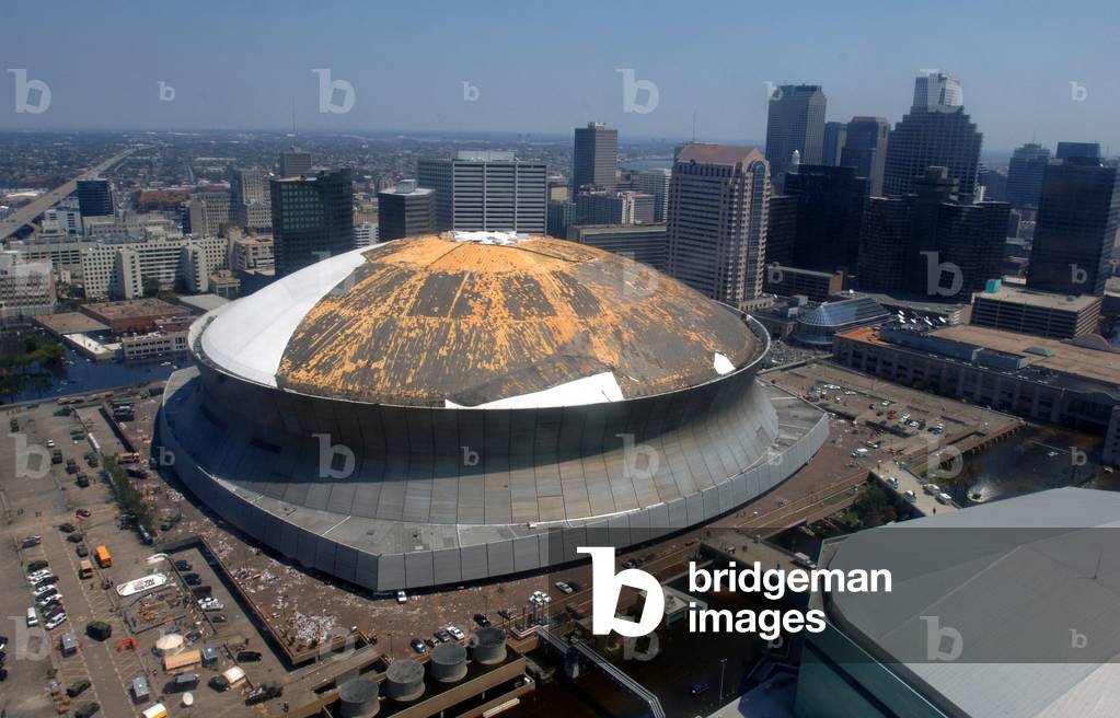 The roof of the New Orleans Superdome was damaged by Hurricane Katrina. The Superdome sheltered thousands of mostly poor people who did not evacuate before the hurricane struck. Sept. 4 2005
