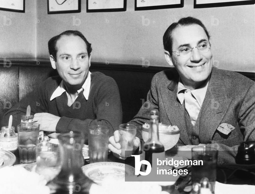 Chico (left) and Groucho Marx at lunch in the famous Brown Derby Restaurant in Hollywood. Feb. 16, 1933