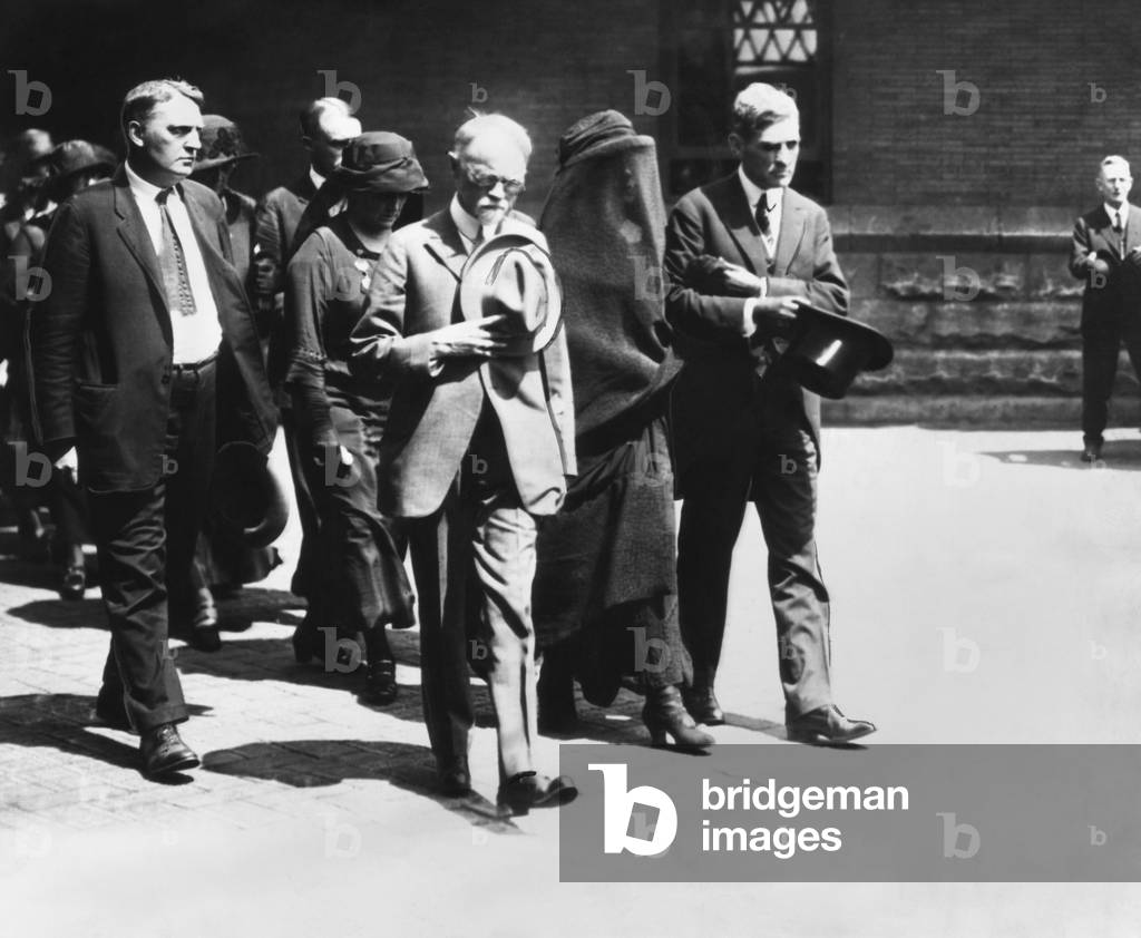Mourners at President Warren Harding's funeral in Washington, D.C. August 7-8, 1923. Leading the group is the President's father, George Tryon Harding, Sr. (center, hat over heart) and the veiled widow, Florence Harding