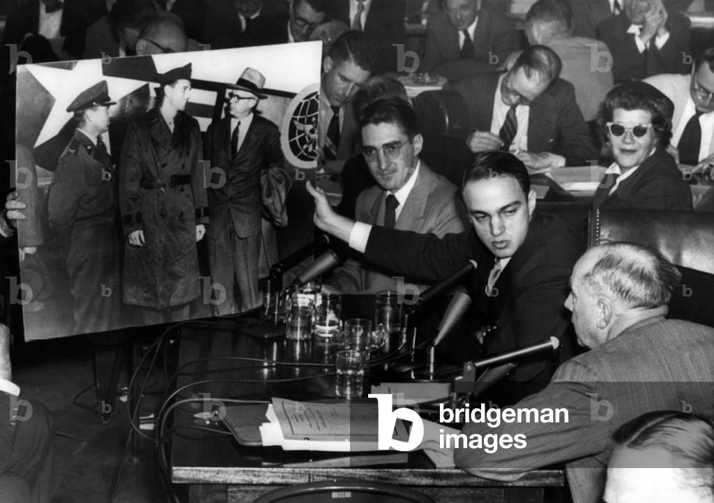 Roy Cohn (center), Senator Joseph McCarthy's attorney during the Army-McCarthy hearings, tries to prove a photo introduced by Army Counsel Joseph Welch (right) was doctored, 1954