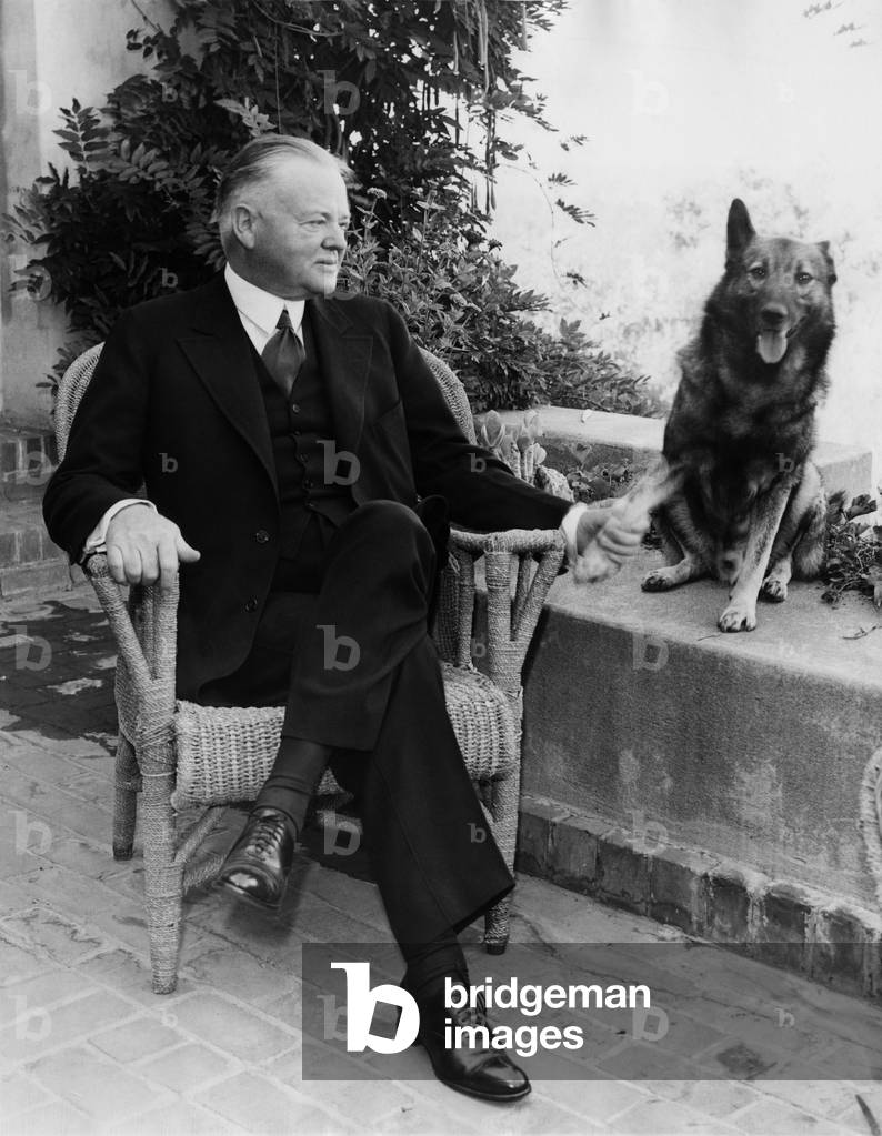 Former President Herbert Hoover (1874-1964), U.S. President 1929-1933, and his norwegian elkhound, September, 1935