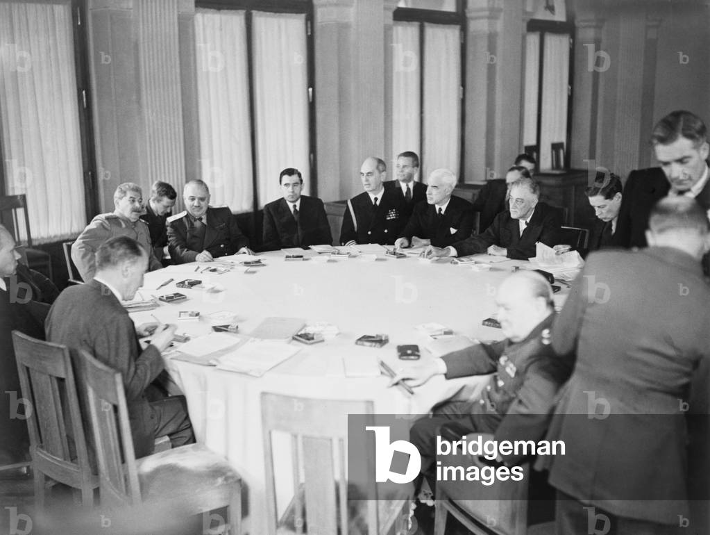 President Franklin D. Roosevelt, Prime Minister Winston Churchill and Marshal Joseph Stalin are shown with others around the conference table at Yalta, Crimea, in the Soviet Union