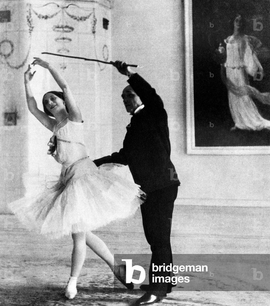 Russian ballet dancer Anna Pavlova (left), training with Maestro Cecchetti in her studio, St. Petersburg, Russia, c. 1910's.