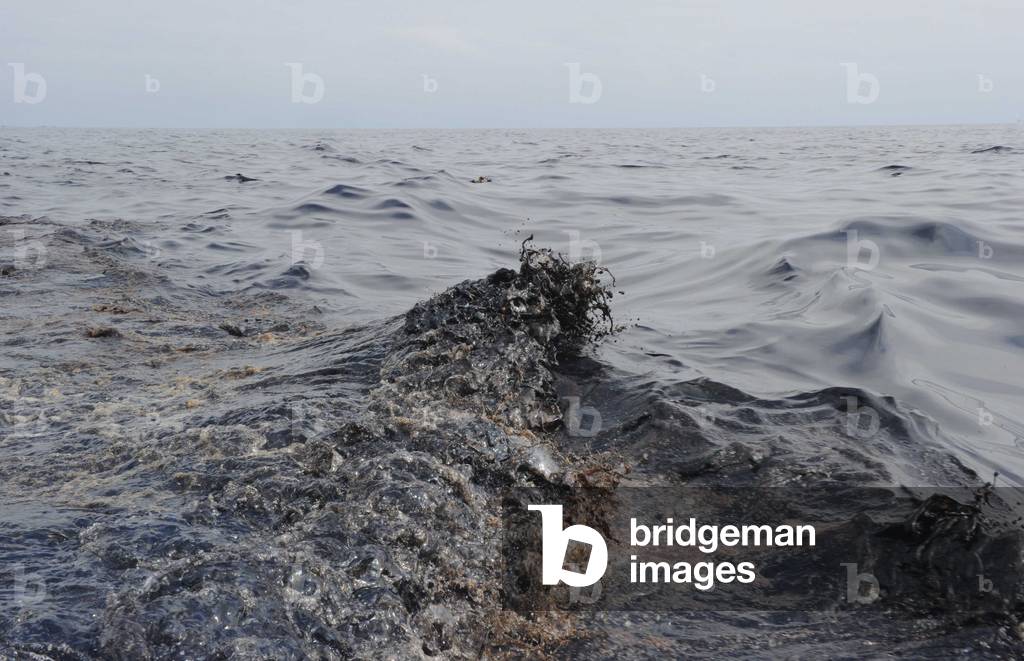 Oil slick in the waves of the Gulf of Mexico caused by the ongoing spill of British Petroleum's Deepwater Horizon offshore drilling rig. May 7 2010