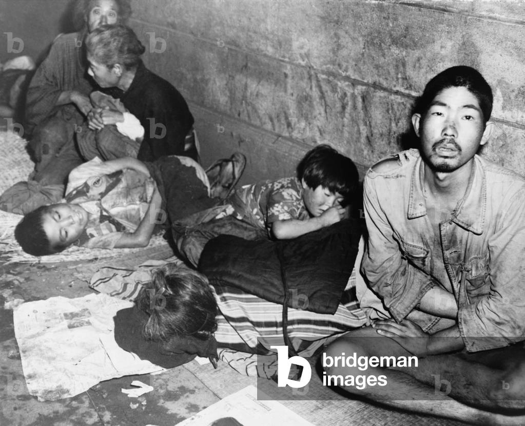 In Tokyo, months after Japan's World War II surrender, homeless Japanese families huddled in subway stations to sleep. October 20, 1945