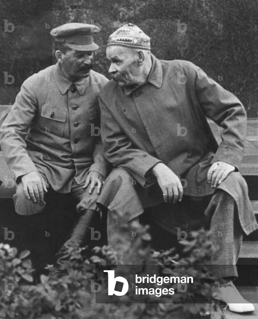Soviet leader Josef Stalin (right) talking with Russian novelist and dramatist Maxim Gorky. They are seated at Lenin's tomb where they received athletes of the 10th Anniversary of the Red Sportintern on August 3, 1931