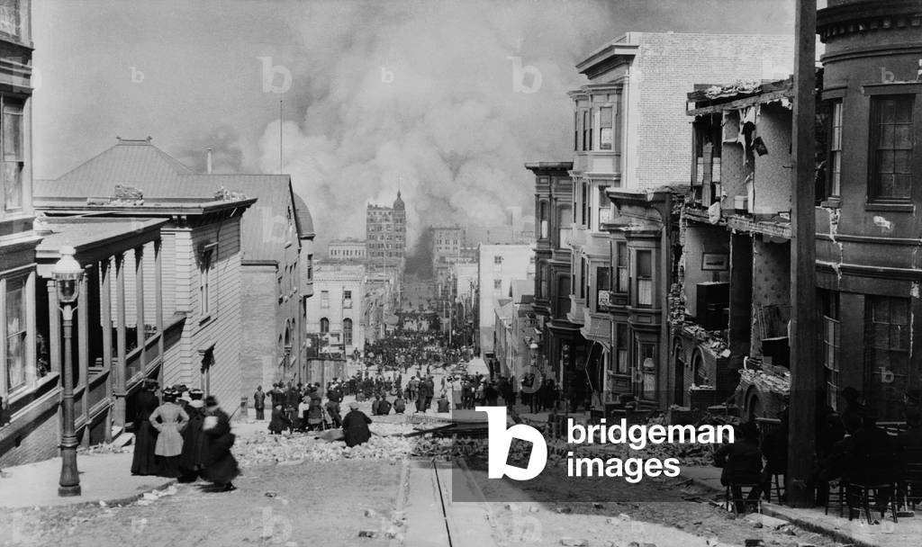 AFTER THE EARTH QUAKE, SAN FRANCISCO. Observers in chairs amid the debris on Sacramento Streetwatch the city burn. The fires, many caused by ruptured gas lines, lasted for 3 days and were more destructive than the earthquake and its aftershocks. Photo by Arnold Genthe