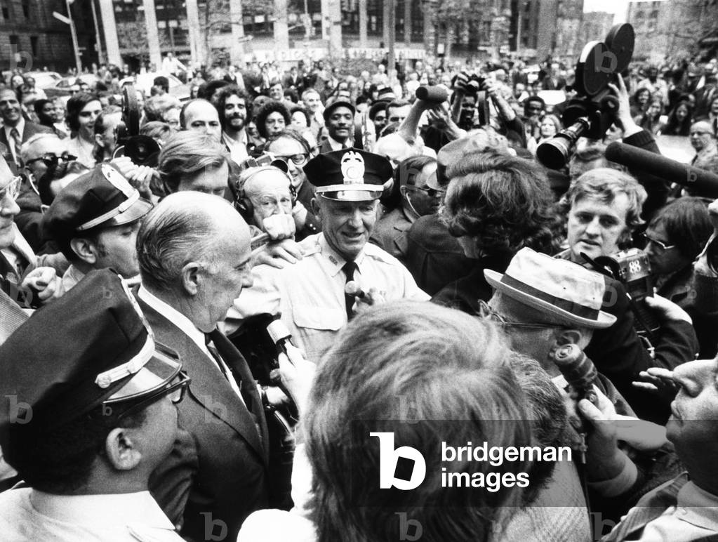 Former Atty. Gen. John Mitchell was escorted by police from New York's Federal Court. April 24, 1973. He testified before a grand jury about a ,000 cash contribution that one individual made to Pres. Nixon's election campaign of 1972