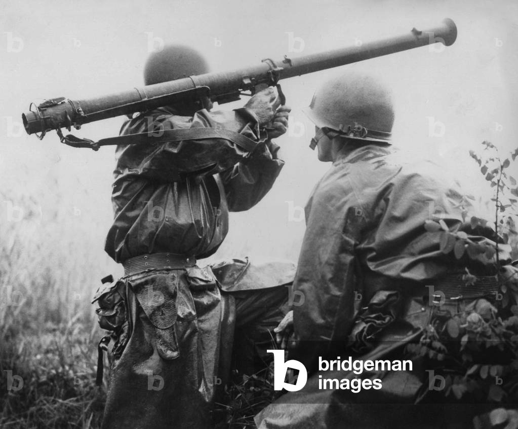 U.S. soldier aims a 2.36-inch bazooka at a North Korean tank during the Battle of Osan. On his right is Kenneth R. Shadrick, one of the first Americans killed in the Korean War. July 6, 1950. The Battle of Osan was the first engagement between United States and North Koreans. 150 Americans were killed or wounded. North Koreans suffered 42 dead and 85 wounded with four tanks destroyed