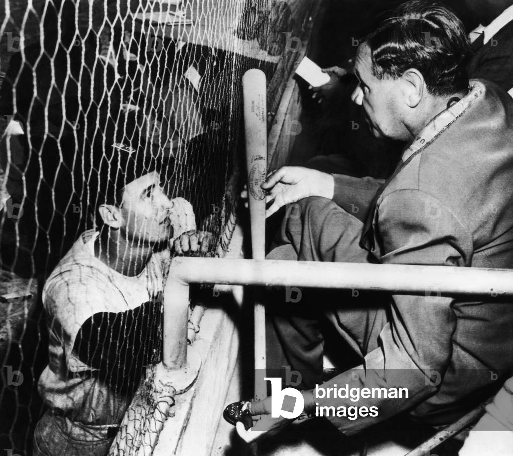 Major League Baseball. Boston Red Sox outfielder Ted Williams, retired New York Yankees outfielder Babe Ruth, c.early 1940s