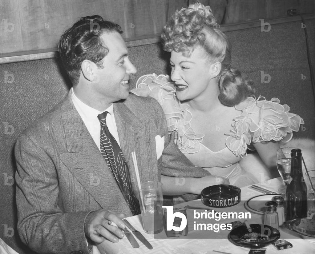 Movie star Betty Hutton with her fiance, newscaster, in Charles Martin at the Stock Club. New York City, Sept. 2, 1943. They never wed, instead she married Ted Briskin on Sept. 3, 1945