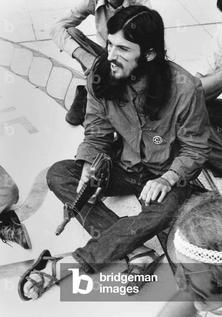 Michael Tola, was subpoenaed by an inquest on March 1, 1971 bombing of the US Capitol. The 'Weather Underground' claimed credit for the bombing. Tola, after receiving the subpoena, rolled it up and lit it like a cigarette