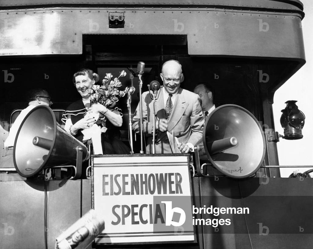 Republican candidate for president Dwight Eisenhower and his wife campaigning on the Eisenhower Special during 1952 election. Nov. 3, 1952