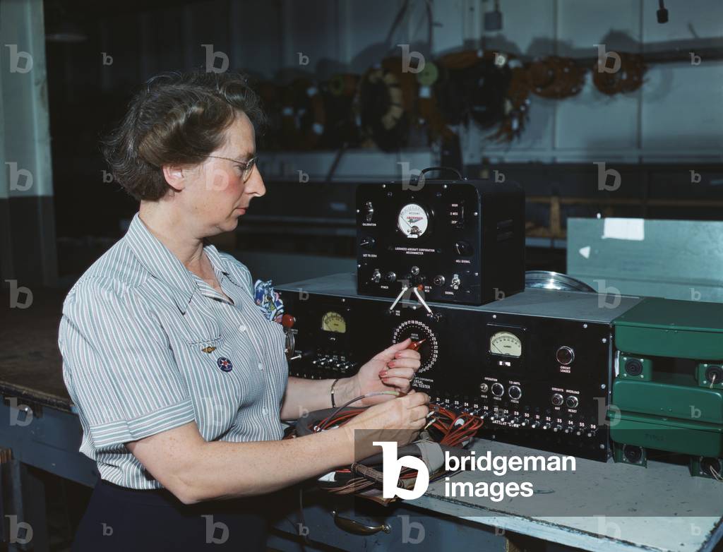 Woman electric wiring technician at Douglas Aircraft Company, Long Beach, California. During World War 2, Oct. 1942