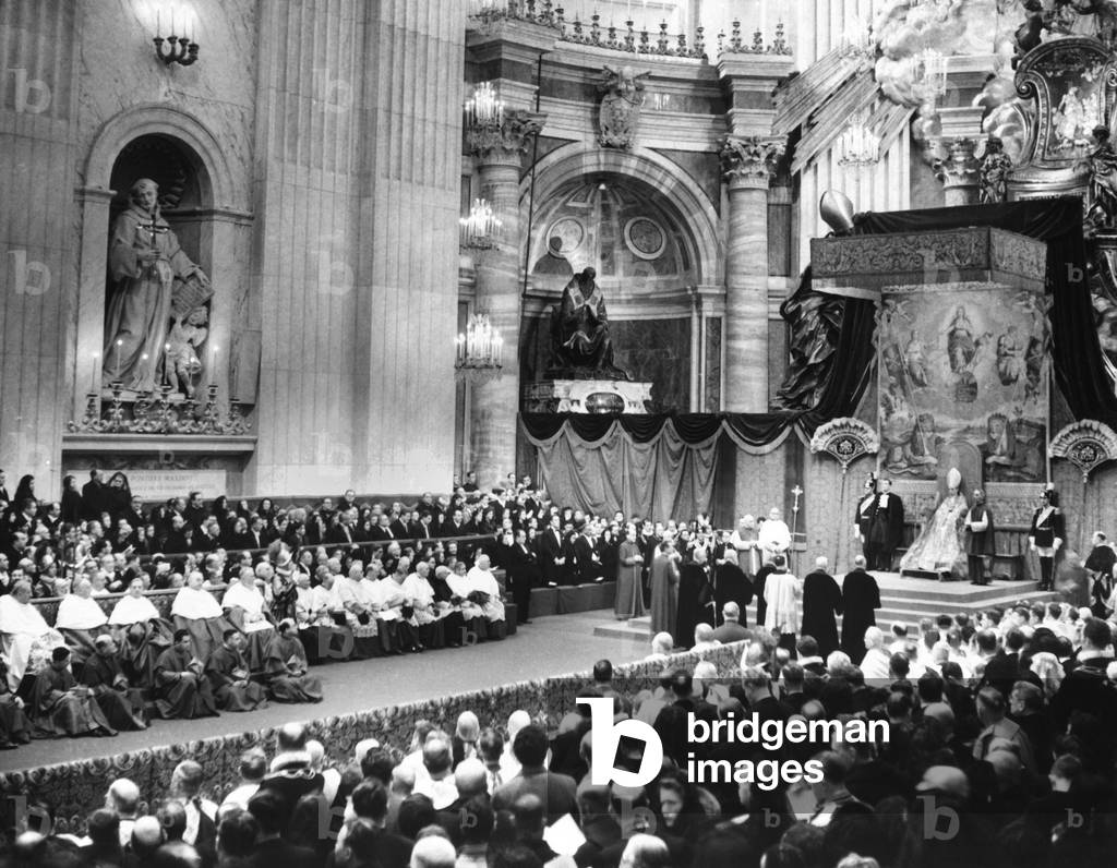 Pope Pius XII on a canopied throne at St. Peter's, conferred the Red Hat upon 17 new cardinals. Jan. 17, 1953