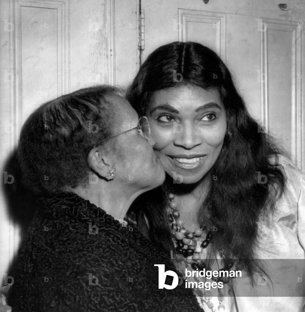 Anna Anderson kisses her daughter, singer Marian Anderson, after a performance of Verdi's 'The Masked Ball' at the Metropolitan Opera, 1955