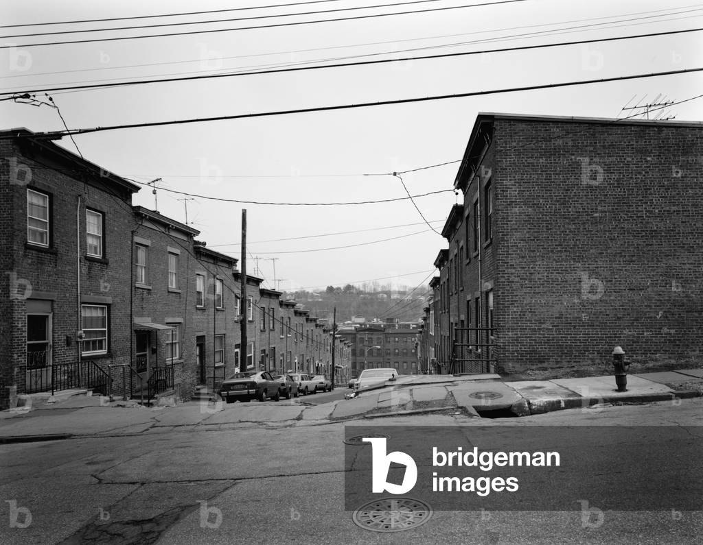 Yonkers, New York, c. 1980. Moquette Row Housing, are 18th century industrial housing reminiscent of architecture in industrial cities of Scotland. View east showing south elevation from Orchard Street. Westchester County, NY
