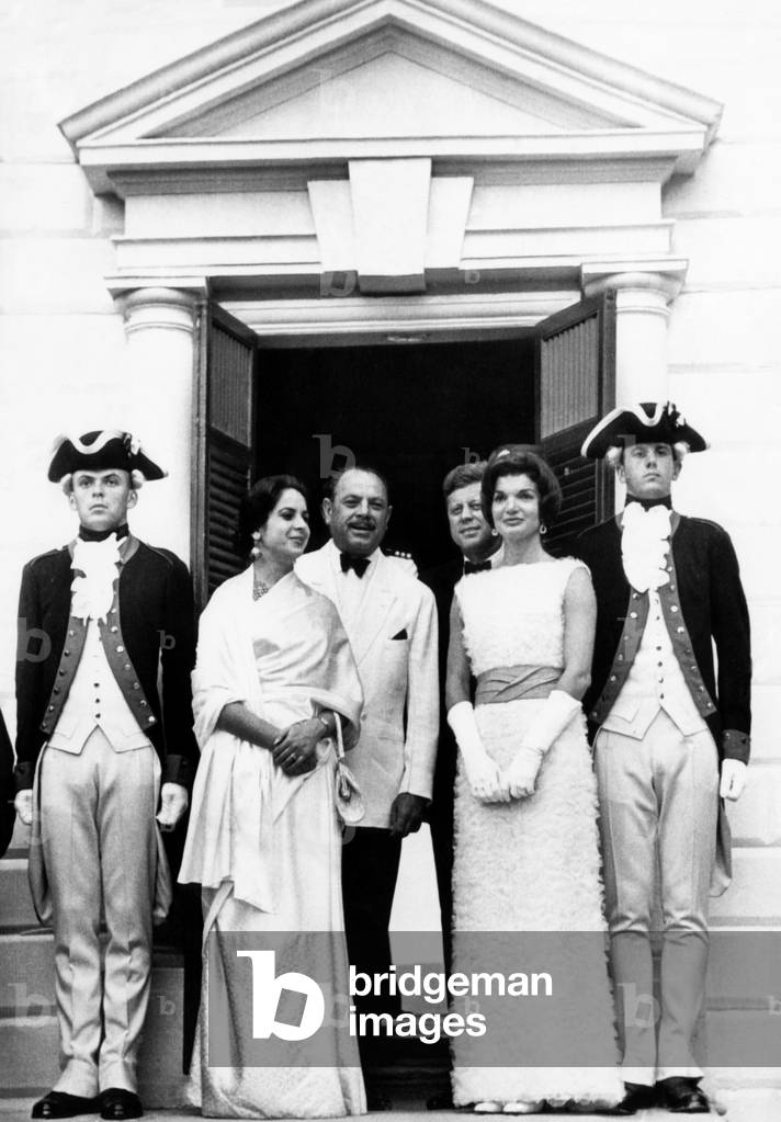 l-r, center four: Pakistan President Mohammed Ayub Khan, his daughter Begum Nasir Akhtar Aurangzeb, United States President John F. Kennedy and First Lady Jacqueline Kennedy, flanked by Army ceremonial guard in Continental Army uniform at the entrance of George Washington's home at Mount Vernon. July 7, 1961