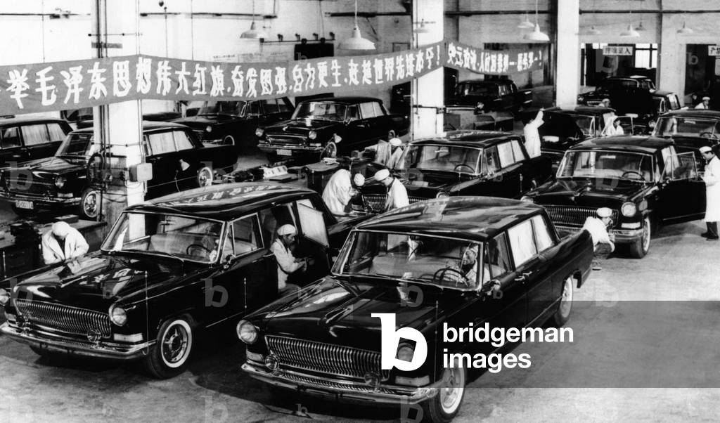 Automobiles just off the production line in Changchun, in Northeast China. Workers give a final checkup to new six passenger cars that have automatic transmissions and V-type engines. June 1966