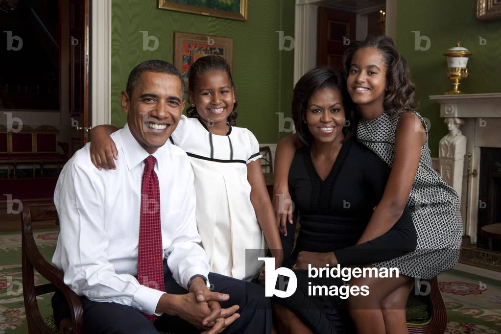 Obama family official portrait by Annie Leibovitz. Sasha and Malia wears dresses by French children's designer Dino e Lucia. Mrs. Obama wears a dress by Azzedine Alaia.,