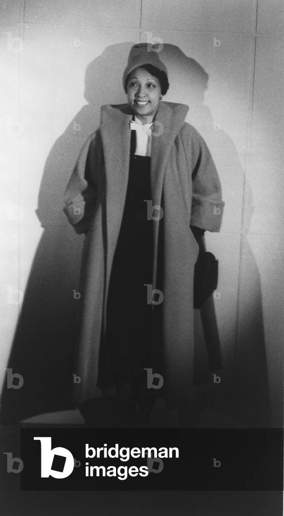 Josephine Baker (1906-1975), dressed in a fashionable, but conservative coat, reflecting her post World War II life as a philanthropist and good will ambassador. 1949
