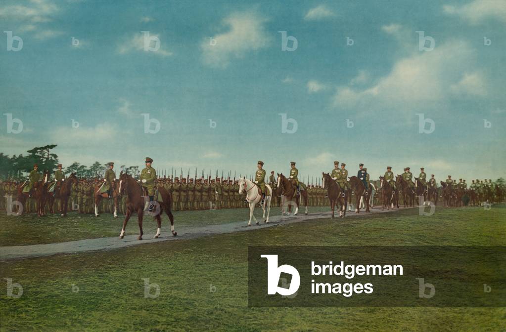 Emperor Hirohito, on white horse, and other military officers reviewing troops, 1941