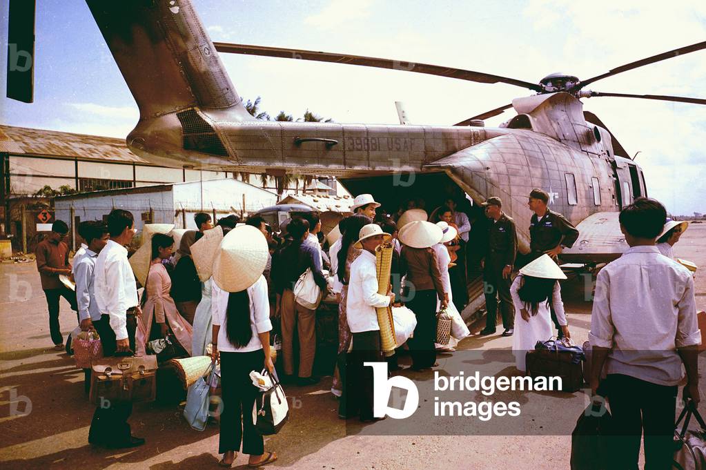 Vietnam War, South Vietnamese villagers board an Air Force CH-3C helicopter for evacuation to another village as U.S. forces battled Viet Cong guerrillas in the area, c.late 1960s