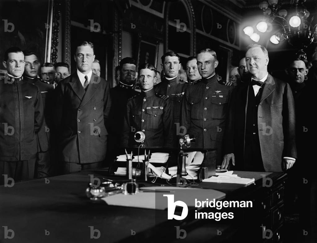Franklin Roosevelt and Navy Secretary, Josephus Daniels, with Navy aviators. 1919. From May 8-27, 1919, in a coordinated Navy operation, they made the first trans-Atlantic flight from New York State to Lisbon, Portugal, in the Curtiss NC flying boat