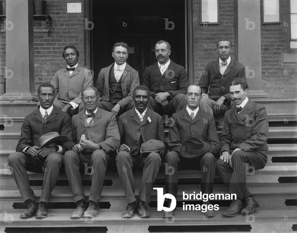 George Washington Carver (1864-1943) was named head of the Agriculture Department at the five year old Tuskegee Normal and Industrial Institute. 1902 portrait with his faculty and staff