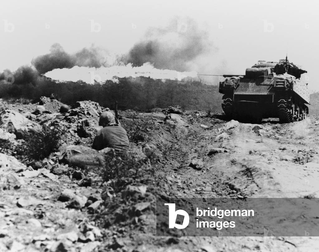 Marine flame-throwing tank and Marine snipers, during the battle of Iwo Jima. c. Feb. 20-March 16, 1945. World War 2