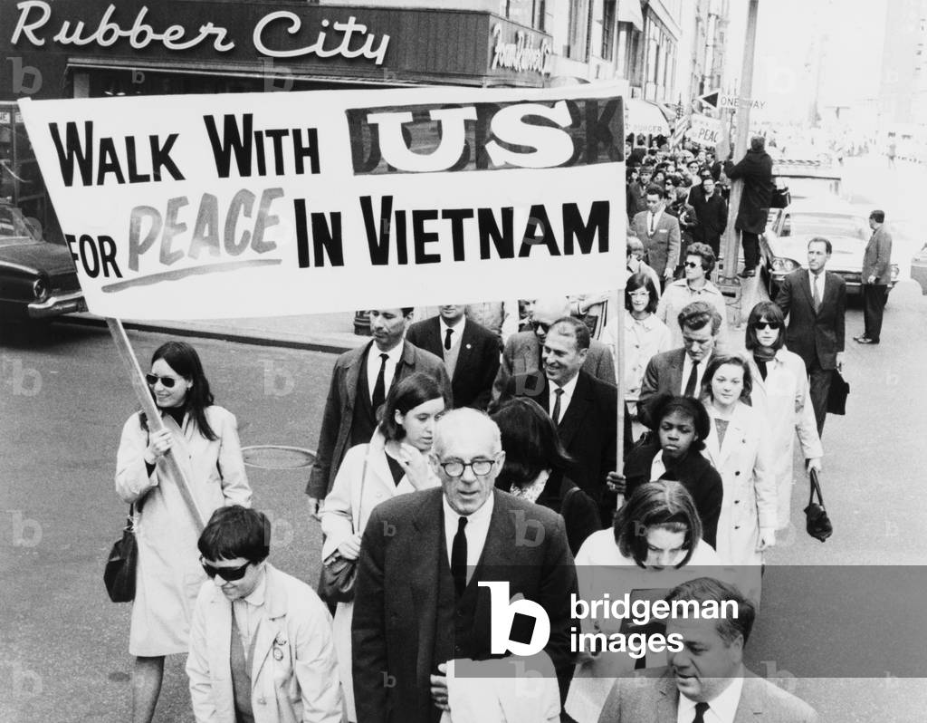 Dr. Benjamin Spock leading a march to the United Nations to demand a cease-fire in Vietnam. c. 1967