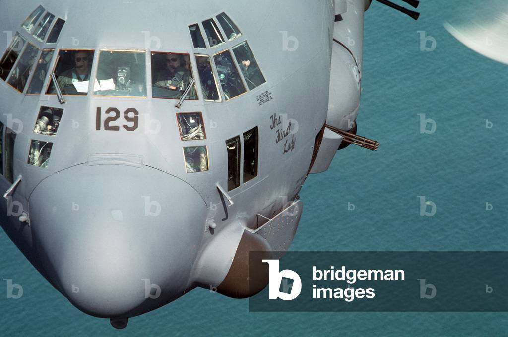 Close-up view of an C-130 Hercules gunship flying during Ronald Reagan's operations against Nicaragua's leftist government. Honduran and U.S. Army Special Forces conducted exercises discourage Nicaragua's raid into Honduras. Apr. 3 1987., Photo by:Everett Collection