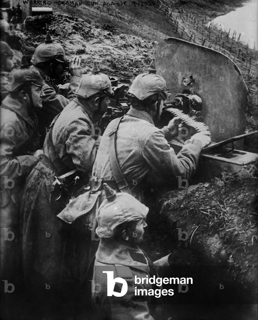 German WW1 machine gun crew firing from a trench on the Eastern Front. 1914-15