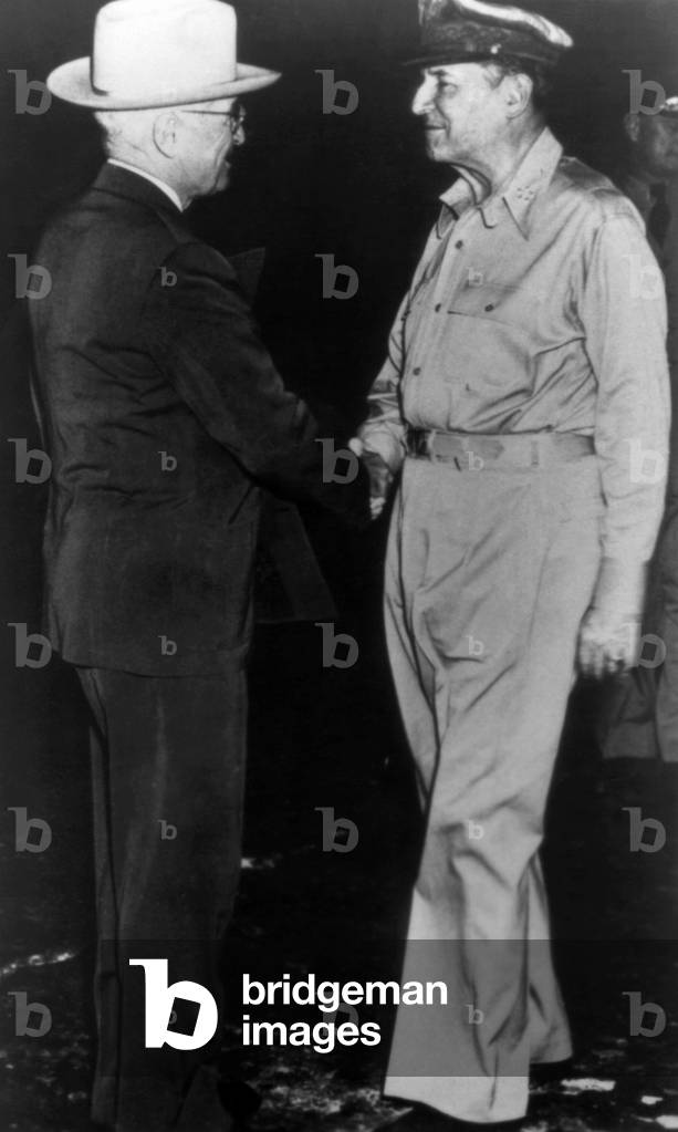 Korean War. From left: US President Harry S. Truman arriving on Wake Island to confer with General Douglas MacArthur on strategy for the Korean War. October 1950