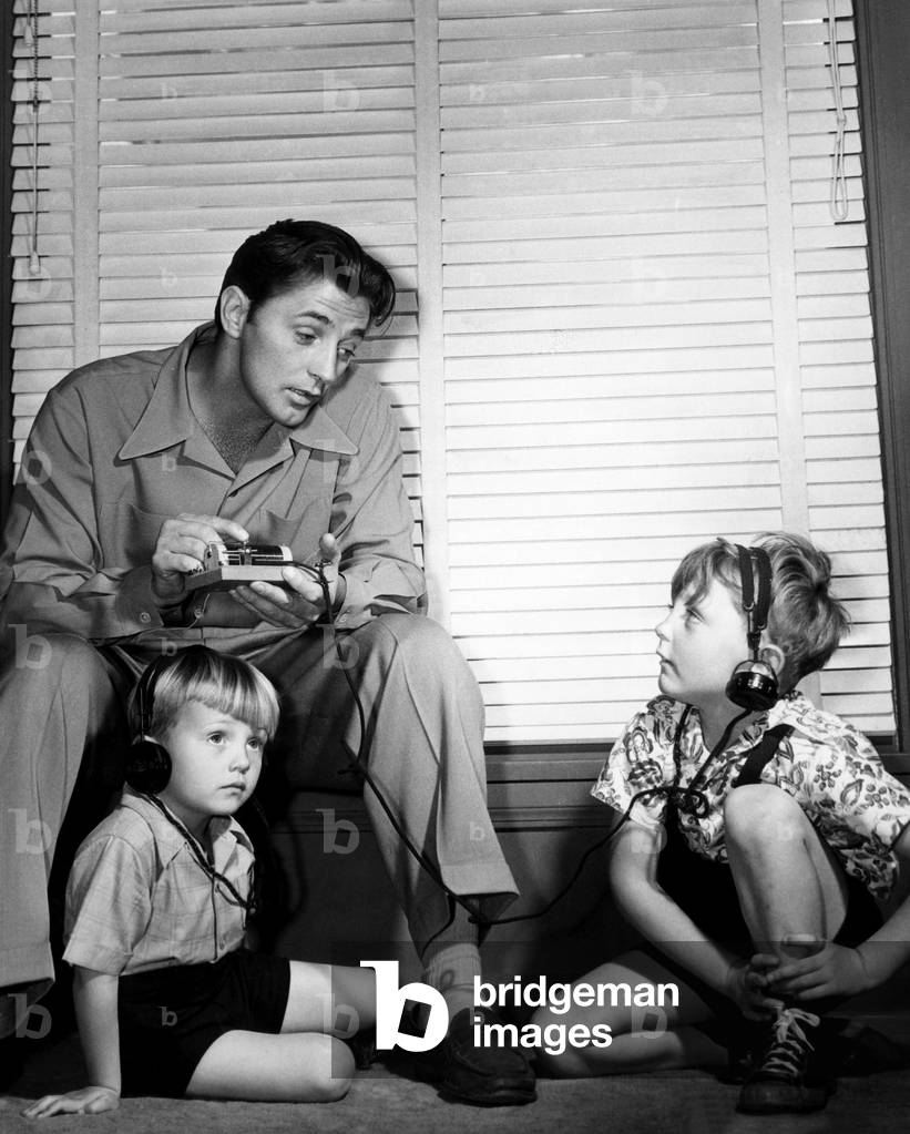 Robert Mitchum (top left), and his sons, Chris Mitchum (left), and Jim Mitchum (right), c.1947