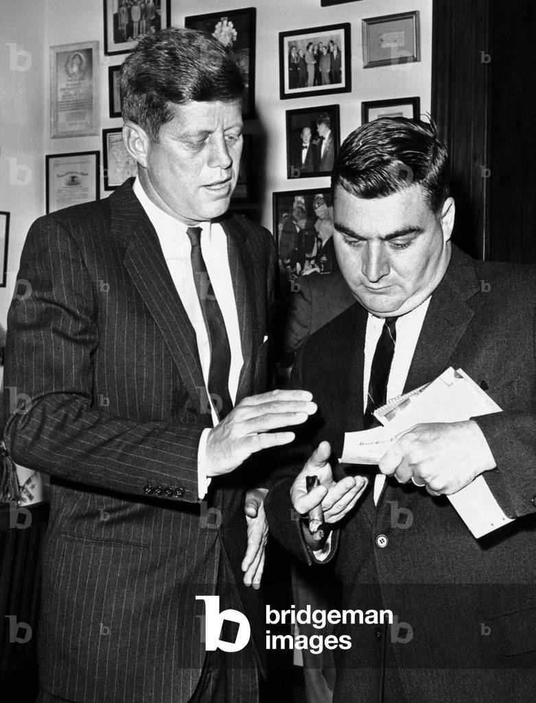 President-elect John Kennedy confers with press secretary Pierre Salinger in his Senate office. Dec. 1, 1960