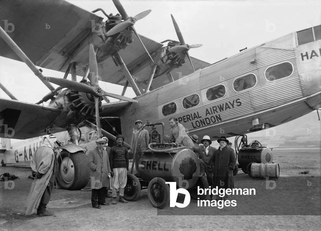 Four engine passenger plane of the Imperial Airways refueling from a Shell Oil Company mobile fuel tank at Semakh, in north Palestine in October 1931. Imperial Airways was the early British commercial long range air transport company, operating from 1924 to 1939 and serving parts of Europe and the extended British Empire