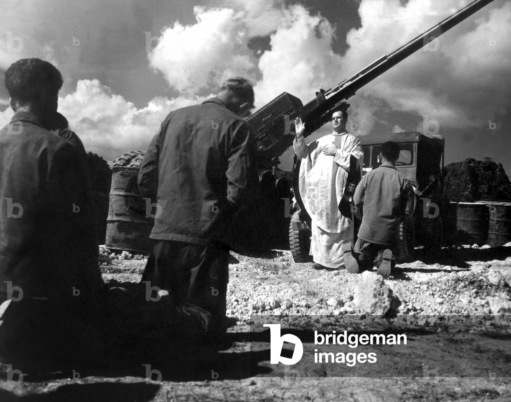 Chaplain celebrates mass for soldiers at Bolo Point, Okinawa. July 19, 1951. Korean War, 1950-53