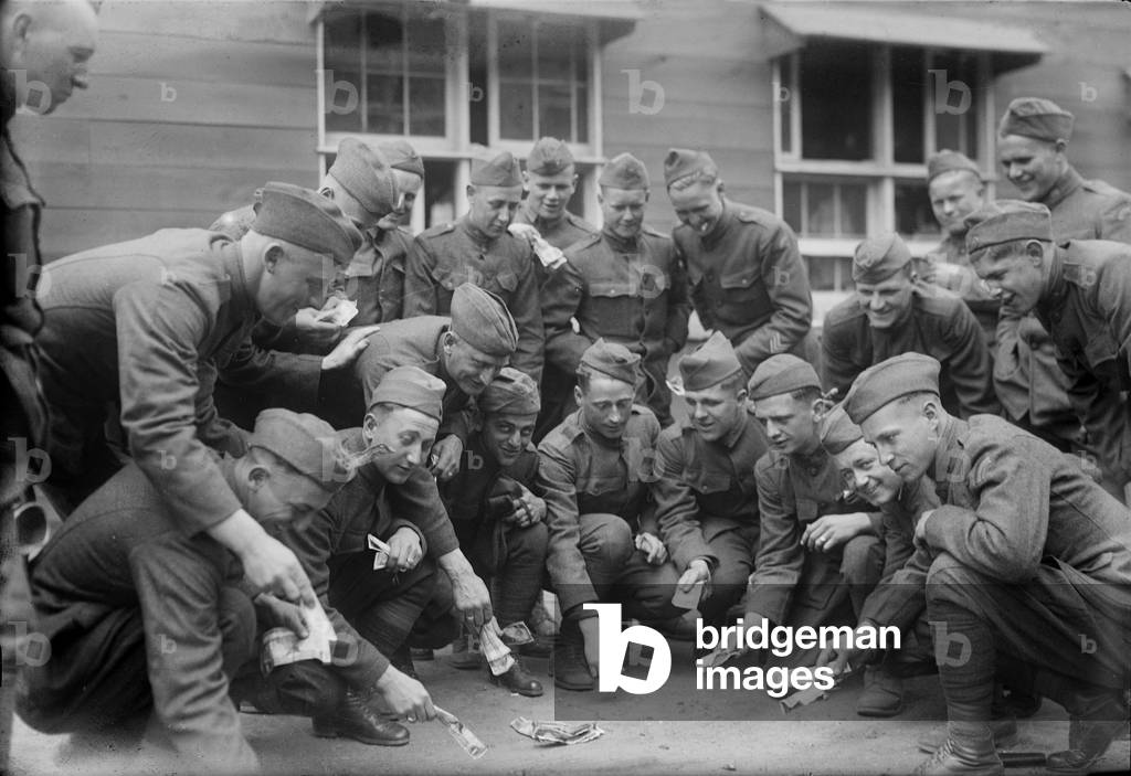 Soldiers playing a dice game, original title: 'Craps at camp', photograph c.1900s-1930s