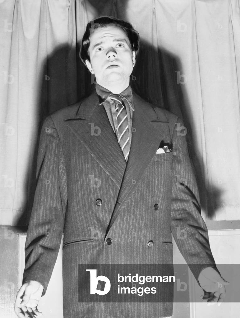 Orson Welles (1915-1985) with his shadow in an expressive portrait from 1938