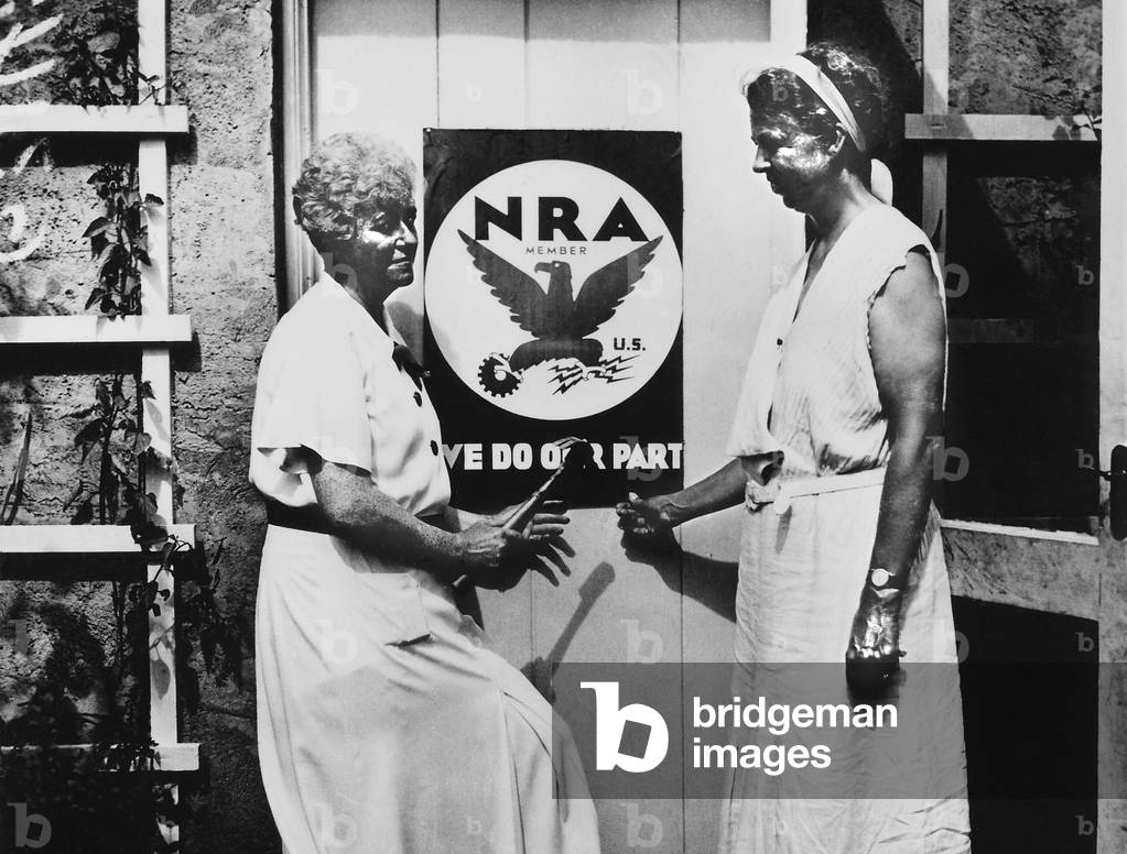 Eleanor Roosevelt and Nancy Cook with a NRA poster at Val-Kill in Hyde Park. 1933. Cook was a feminist, teacher, and executive secretary of the Women's Division of the State Democratic Committee