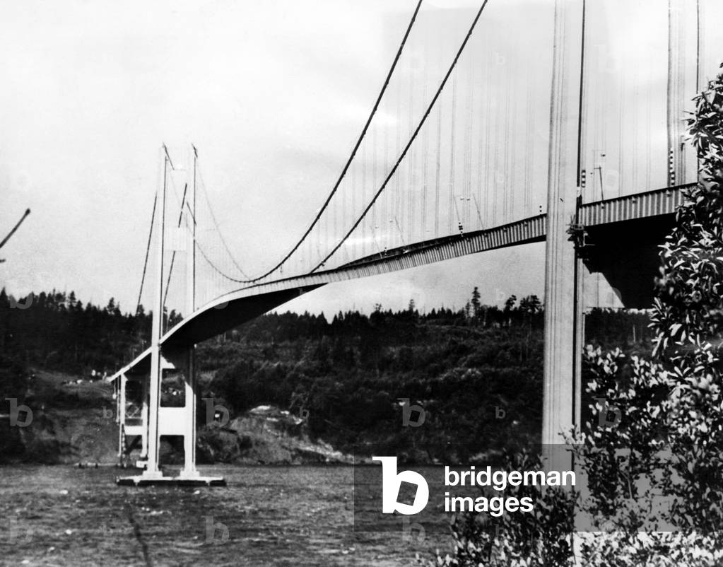 The narrows bridge across Puget Sound in Tacoma, Washington is twisted by a high wind. The bridge collapsed minutes later, 1940
