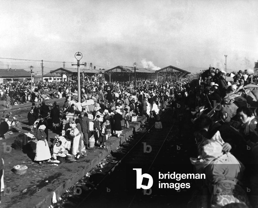 Refugees crowd railway depot at Inchon, Korea, Jan. 3, 1951. They are fleeing the advancing North Korean/Chinese troops after the failure of the UN invasion (Nov.-Dec.-1950) above the 38th parallel. Nearby Seoul fell to the Communists on Jan. 7, 1951. Korean War, 1950-53